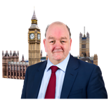 Photo symbol image of man in suit in front of Houses of Parliament