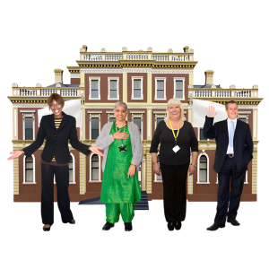 Four councillors standing in front of a local council building.