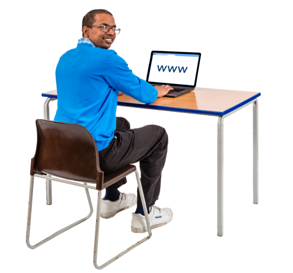 A man sitting at a desk using a laptop.